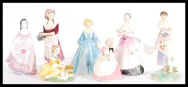 A collection of ceramic figurines to include Royal Doulton Cookie HN 2218, Spring HN 2085, The