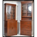 A pair of 1930's Art Deco mahogany library bookcase cabinets. Each being raised on plinth bases with