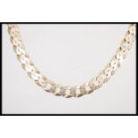 A hallmarked 9ct gold large curb link necklace chain having a lobster claw clasp. Measures 52cms