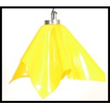 A mid century retro original handkerchief ceiling lamp light having the original vibrant yellow
