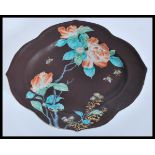 A 19th Century Chinese porcelain tray plate of scalloped form having a brown ground with hand