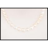 A vintage 20th Century freshwater pearl necklace having an 18ct gold magnetic clasp. Complete in