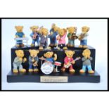 A collection of 12 x Cliff Richard Rock 'N' Roll Bearsby the Danbury Mint resin teddy bear figurines