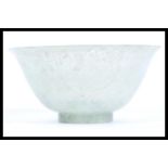 A 19th Century Chinese jade tea cup bowl of conical form having a mottled green jade colourway.