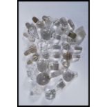 A collection of glass decanter / bottle stoppers of various forms most being crystal cut glass