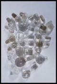 A collection of glass decanter / bottle stoppers of various forms most being crystal cut glass