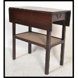 A 19th Century mahogany double drop leaf artists table, single frieze drawer with fitted swag