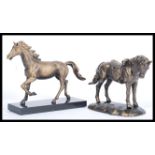 Two 20th century cast iron bronze effect figures of horses. Both mounted on raised bases. Tallest