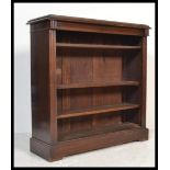A Victorian 19th century solid mahogany open window bookcase cabinet. Raised on a plinth base with