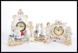 A collection of 19th and later Century porcelain figures to include two clocks one adorned with