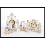A collection of 19th and later Century porcelain figures to include two clocks one adorned with
