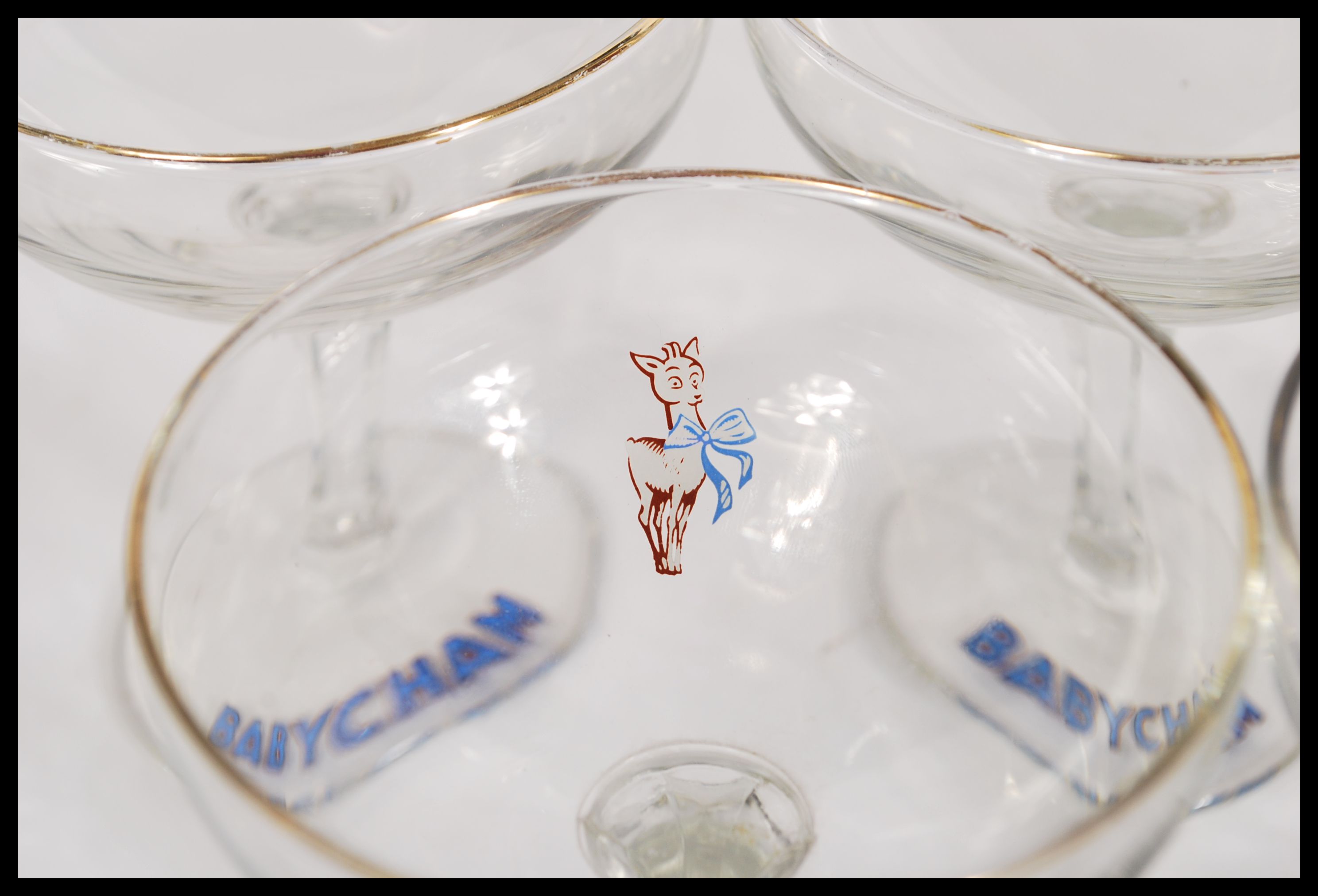 A set of ten vintage retro 20th Century Babycham glasses raised on circular bases with gilt rim - Image 4 of 5