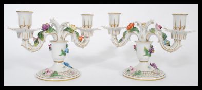 A pair of Dresden porcelain double sconce candelab