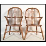 A pair of 20th century Brights of Nettlebed style large oak Windsor chairs /  armchairs having