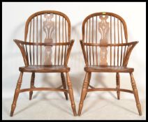 A pair of 20th century Brights of Nettlebed style large oak Windsor chairs /  armchairs having