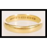 A 22ct gold band ring, hallmarked Birmingham date letter V, weight 7.2g, size W.5.