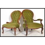 A pair of 19th Century Victorian walnut framed spoonback library / lounge chairs, both upholstered