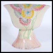 An early 20th Century Art Deco Clarice Cliff for Newport Pottery, a Pink Pearls pattern footed