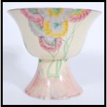 An early 20th Century Art Deco Clarice Cliff for Newport Pottery, a Pink Pearls pattern footed