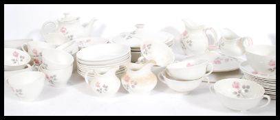 A Royal Doulton English translucent China dinner and tea service in the Pillar Rose pattern.