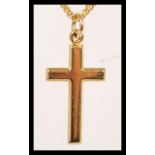 A hallmarked 9ct gold pendant crucifix necklace having a spring ring clasp. International hallmarks,