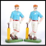 A pair of cast iron doorstops, in the form of Edwardian Cricketers / Cricket Players. Both hand