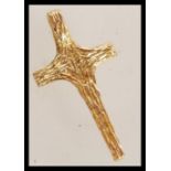 A hallmarked 9ct gold cross crucifix pendant having textured bark effect design with necklace bale