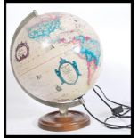 A mid century vintage / retro desk top globe with light up illumination inner having the globe being