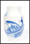 A 19th century blue and white Chinese vase having a tapered neck and rim with hand painted scenes of