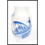 A 19th century blue and white Chinese vase having a tapered neck and rim with hand painted scenes of