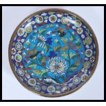 A 19th Century Japanese Meiji period Cloisonne plate on copper having decoration of birds and