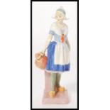 A Royal Doulton ceramic figurine entitled Gretchen, HN1397. Stamped to base. Measures 20cm high.