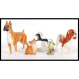 A selection of china animal figurines to include a Royal Doulton Boxer dog figurine marked Warlord