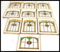 A set of ten early 20th Century Edwardian stained glass windows in the Arts and Crafts / Art Nouveau