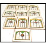 A set of ten early 20th Century Edwardian stained glass windows in the Arts and Crafts / Art Nouveau