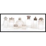 A selection of cut glass and hallmarked silver cruet items to include a Henry Manton cruet (