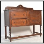 An early 20th Century Edwardian oak sideboard with galleried back and two drawers next to single