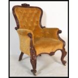 A 19th century Victorian mahogany armchair of rococo form having a stunning show wood frame raised