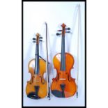 Two 20th Century violins to include a Skylark Cantonese violin with a dark wood and horsehair bow