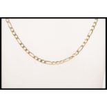 A 9ct gold figaro necklace chain with a lobster clasp. Stamped with a 375 common control mark. Total