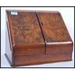 An early 20th century Edwardian oak & walnut desk calendar and stationery tidy compendium having