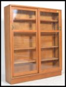 A mid 20th century solid golden oak upright lawyers bookcase cabinet having multiple shelves with