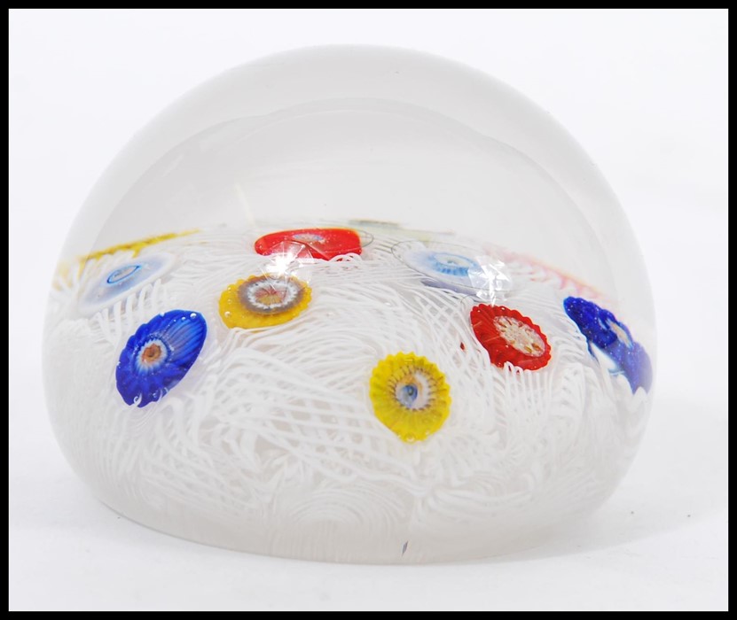A 20th Century glass paperweight with random murrine canes atop a muslin ground cased in a clear - Image 2 of 6