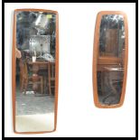 Two vintage retro 20th Century teak wood frameless wall mirrors. Measures: 95cm high x 35cm wide.