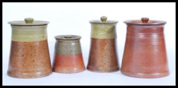 A selection of early 20th Century stoneware pottery storage jars / pots of cylindrical form with