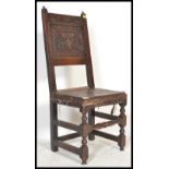 A 17th Century oak high back dining chair. The cha