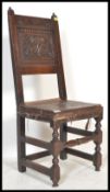 A 17th Century oak high back dining chair. The cha
