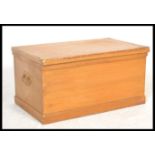 A 19th Century Victorian pine blanket box, hinged top with clasp to front, carry handles to side