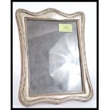 An early 20th century silver hallmarked easel photograph frame bearing marks to lower corner. The