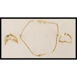 A hallmarked 9ct gold box chain and ball bracelet together with two hallmarked 9ct gold wishbone
